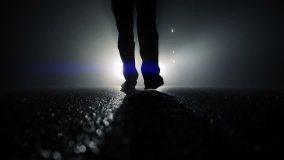 feet in darkness